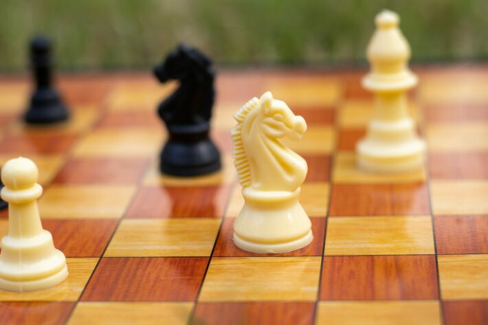 Can a knight jump over other pieces in chess